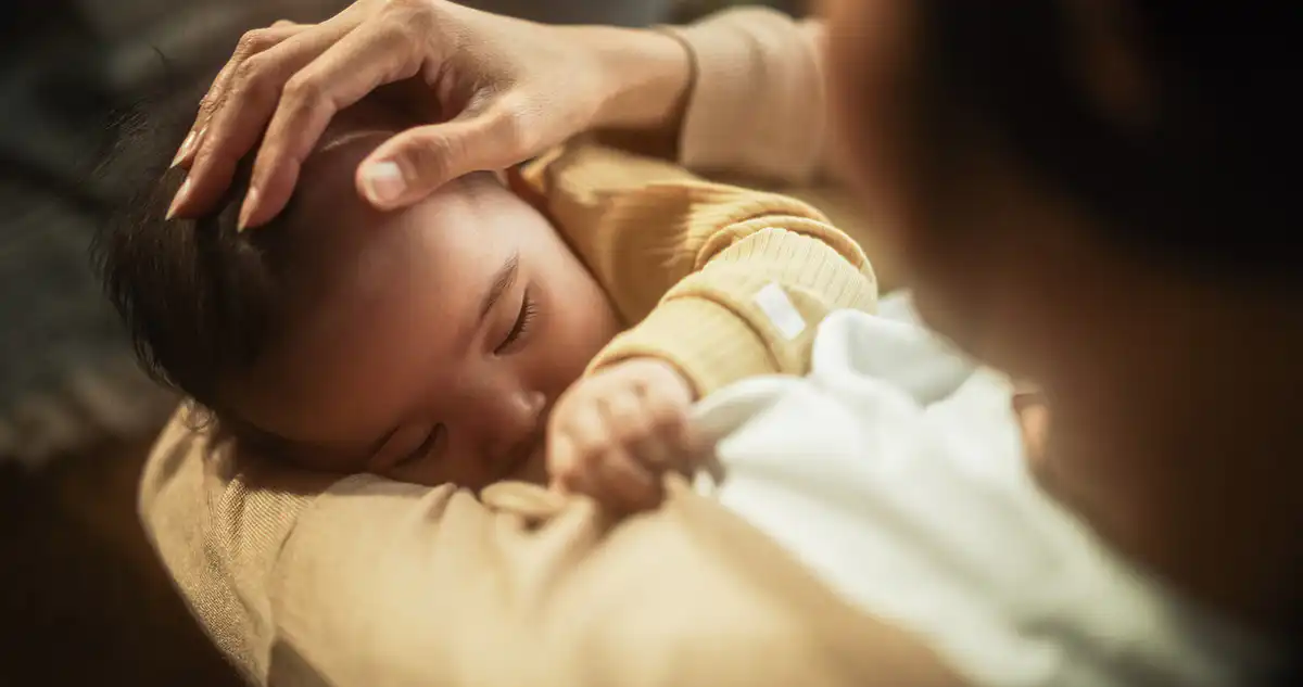 Mother breast feeding baby