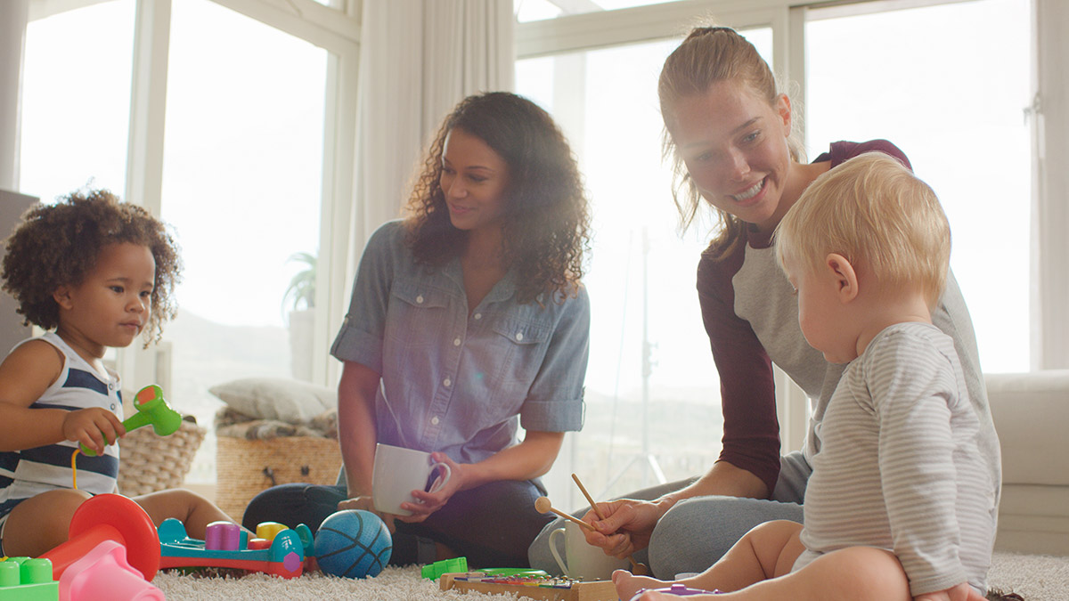 Mothers playing with their babies